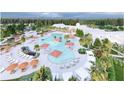 Aerial view of a resort-style pool with lounge chairs, palm trees, and outdoor dining areas at 1004 Tulip Shell, Summerville, SC 29485