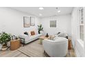 Bright living room with modern furnishings, neutral colors, and natural light at 1112 Melvin Dr, Hanahan, SC 29410