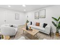 Elegant living room featuring contemporary furniture, modern art, and decorative plants at 1112 Melvin Dr, Hanahan, SC 29410