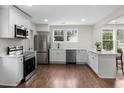 Modern kitchen with stainless steel appliances, white cabinets, and hardwood floors at 1226 Pickens St, Hanahan, SC 29410