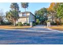 Lovely home with a spacious driveway, mature trees and lush landscaping at 1784 Omni Blvd, Mount Pleasant, SC 29466