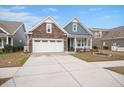 Charming single-Gathering home featuring a stone facade, two-car garage, and covered front porch at 2006 Barn Swallow Rd, Summerville, SC 29483