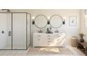 Elegant bathroom with a double vanity, sleek black fixtures, and a glass-enclosed shower at 2018 Mcguire Ln # 005, Hollywood, SC 29449