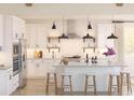 Bright, modern kitchen with white cabinetry, stainless steel appliances, and a center island with stool seating at 2022 Mcguire Ln # 006, Hollywood, SC 29449