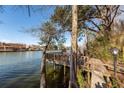 Picturesque lake scene featuring a private wooden dock extending into the water at 210 Lakeview Dr, Summerville, SC 29485
