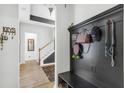 Inviting foyer with coat rack, hardwood floors, and a view of the stairs and living spaces beyond at 229 Celestial Blvd, Summerville, SC 29486