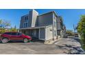 An exterior view shows a multi-level building with parking available in front of it at 259 E Bay St # 1 C, Charleston, SC 29401