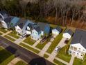Aerial view of a residential home with a detached garage surrounded by well-maintained landscaping at 2710 Mcfadden Way, Johns Island, SC 29455