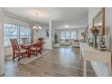 Open-concept living and dining area with hardwood floors and natural light at 428 Avocet Dr, Summerville, SC 29486