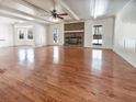 Spacious living room with hardwood floors, a brick fireplace, and an open layout at 503 Middleton Blvd, Summerville, SC 29485