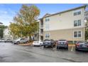 Building exterior shows ample parking and a well-maintained facade under a blue sky at 700 Daniel Ellis Dr # 8108, Charleston, SC 29412