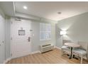 Bedroom area with a table and chair set up for relaxation at 1126 Ocean Blvd # 109, Isle of Palms, SC 29451
