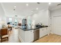 Open-concept kitchen flows into the light-filled living area at 118 Cooper River Dr, Mount Pleasant, SC 29464