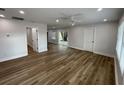 Spacious living room featuring recessed lighting, modern flooring, and access to the outside, with white trim at 1508 Greenbay Dr, North Charleston, SC 29406