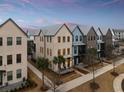 An aerial view of a row of elegant townhomes showcasing varied exterior design and landscaping at 1566 Hancock St # B-1, Mount Pleasant, SC 29464