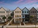 Attractive townhomes with varied exterior finishes complemented by well-maintained landscaping and walkways at 1566 Hancock St # B-1, Mount Pleasant, SC 29464