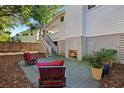 Inviting patio features a charming outdoor fireplace and comfortable seating, perfect for relaxation at 16 42Nd Ave, Isle of Palms, SC 29451