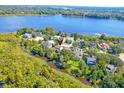 A stunning aerial view showcases this home's desirable location on the lake with ample surrounding greenery at 1756 Indigo Island Dr, Hanahan, SC 29410