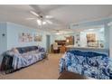 Inviting living room with comfortable seating, a ceiling fan, and a view into the adjacent kitchen area at 1860 Montclair Dr # 1860-A, Mount Pleasant, SC 29464