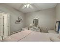 Cozy bedroom featuring neutral walls, an ornate vanity, and a comfortable bed with pink accents at 2005 Carriage Way, Summerville, SC 29485