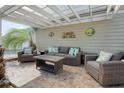 Covered patio featuring comfortable seating, decorative accents, and a relaxing outdoor space at 213 Crossandra Ave, Summerville, SC 29483