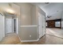 Hallway featuring neutral paint, tile and carpet flooring, with access to multiple rooms at 240 Island Green Rd, Goose Creek, SC 29445