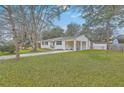 Charming home with a well-kept lawn, carport, and storage shed in the backyard at 337 Cessna Ave, Charleston, SC 29407