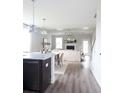 Open-concept living area with hardwood floors, fireplace, and stylish decor with neutral colors at 338 Hillman Trail Dr, Moncks Corner, SC 29461