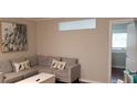 Inviting living room featuring a comfortable gray sectional and stylish decor at 40 Bee St # 309, Charleston, SC 29403