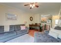 Cozy living room with a sofa, dining table, and view into the kitchen area at 949 E Estates Blvd # 303, Charleston, SC 29414