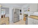 Bright kitchen features stainless steel appliances, stone countertops, and easy access to living areas at 1137 Windsome Pl, Mount Pleasant, SC 29464