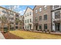 Elegant townhomes with well-maintained lawns, sidewalks, and attractive landscaping at 1510 Martel St, Mount Pleasant, SC 29464