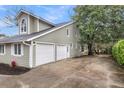 Home exterior featuring a two-car garage and beautiful architecture at 1545 Sterling Oaks Dr, Moncks Corner, SC 29461