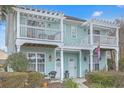 Charming two-story townhouse with dual balconies and a welcoming facade at 1608 Fetterbush Ln, Johns Island, SC 29455