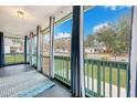 View from the porch with green railings and blue and white curtains at 1618 Yost Ln, Johns Island, SC 29455