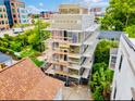 Home under construction with scaffolding, showing its transformation and the construction progress amidst urban surroundings at 254 Saint Philip St # B, Charleston, SC 29403