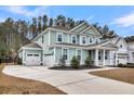 Spacious two-car garage and long driveway enhance this charming two-story home at 295 Calm Water Way, Summerville, SC 29486