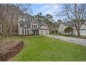 Charming two-story home with a well-manicured lawn and a two-car garage at 3216 Rose Walk Ct, Mount Pleasant, SC 29466