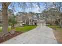 Charming two-story home with a well-manicured lawn and a two-car garage at 3216 Rose Walk Ct, Mount Pleasant, SC 29466