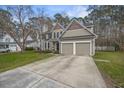 Charming two-story home with a well-manicured lawn and a two-car garage at 3216 Rose Walk Ct, Mount Pleasant, SC 29466