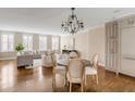 Bright living room with hardwood floors, dining area, neutral furniture, and plenty of natural light at 38 Elliott St, Charleston, SC 29401