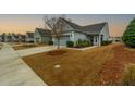 Attractive single-Gathering home with a well-kept yard and inviting entrance, nestled in a peaceful suburban street at 402 Switchgrass Dr, Summerville, SC 29486