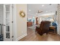 Comfortable living room with hardwood floors, a leather armchair, and French doors leading to the next room at 402 Switchgrass Dr, Summerville, SC 29486