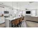 Open kitchen featuring an island with counter seating, pendant lighting, and modern appliances at 46 Clearblue Loop, Summerville, SC 29486