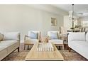 Stylishly furnished living room with plush seating, patterned rug, and modern coffee table at 4993 Lake Palmetto, North Charleston, SC 29418