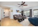 Inviting living room area with wood floors, a sliding glass door to the outside, and comfortable furniture at 700 Daniel Ellis Dr # 8304, Charleston, SC 29412