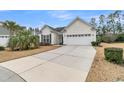 Single-story home featuring an attached two-car garage, neat landscaping, and concrete driveway at 714 Battery Edge Dr, Summerville, SC 29486