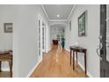 Inviting foyer featuring hardwood floors, neutral paint, and views into the living spaces at 714 Battery Edge Dr, Summerville, SC 29486