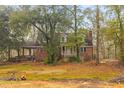 Charming brick home with a cozy porch and lots of tree coverage at 7537 Parkers Ferry Rd, Adams Run, SC 29426