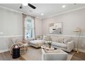 Bright living room with a comfortable sectional, stylish armchairs, and elegant decor at 826 Alma Square Dr, Moncks Corner, SC 29461